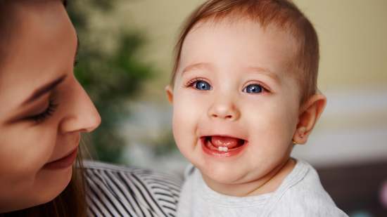 Give a teething baby a gum massage